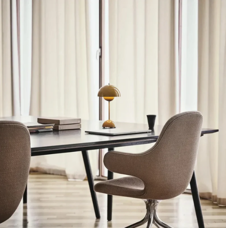 Minimalist modern LED table lamp, touch-controlled, adds contemporary flair to any home or office space.