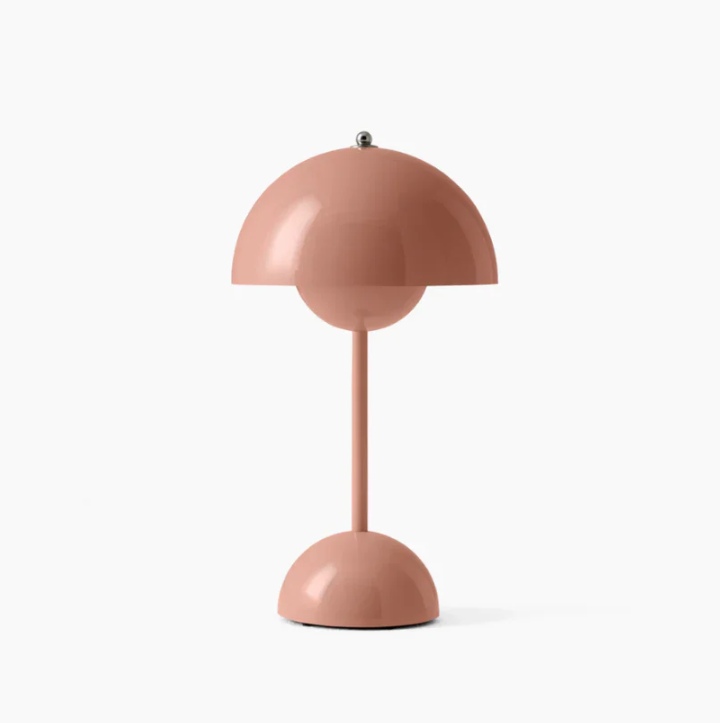 Stylish contemporary LED table lamp, touch-activated, enhancing bedroom or desk lighting decor.