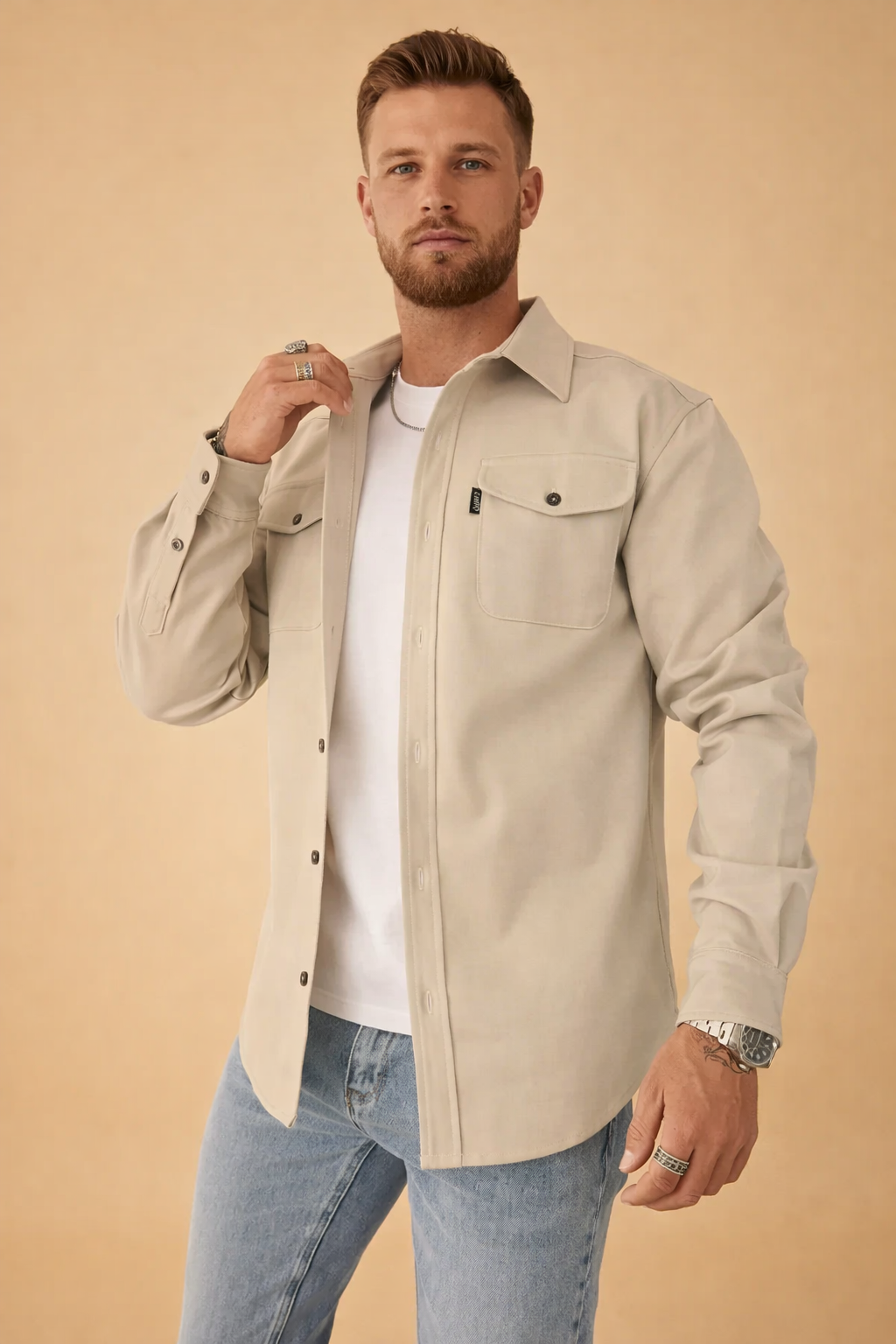 Stylish men's long-sleeve polo shirt. Features utilitarian design & button placket for modern casual wear.