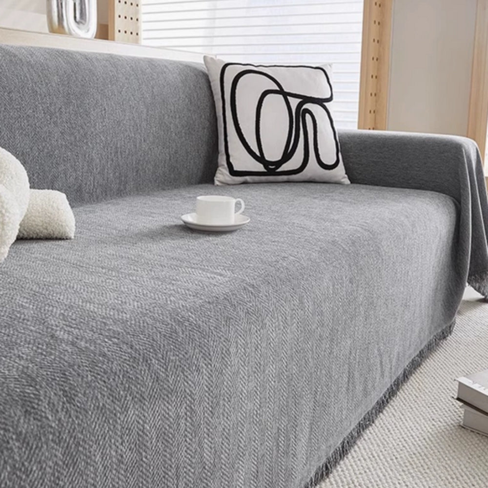 Pet-friendly modern sofa throw blanket, offers stylish furniture protection & easy care for your living room.
