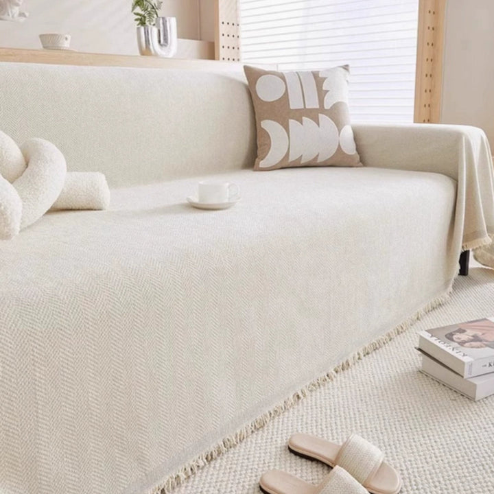 Versatile modern furniture cover, a minimalist sofa throw providing style & pet-friendly protection in the living room.