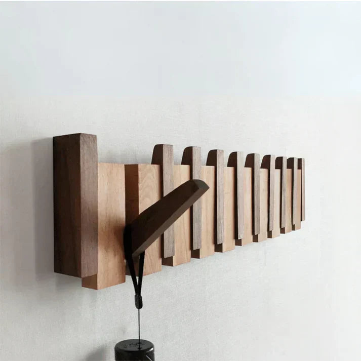 Elegant piano key wooden wall coat rack, 4 hooks. Unique and space-saving home decor for any entryway.