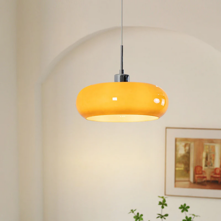 Modern RadianceOrb round LED pendant light. Emits warm white light, perfect for contemporary home decor.