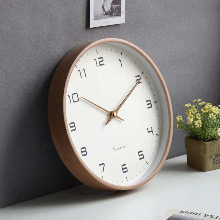 Sleek white Scandinavian silent wall clock, a minimalist modern home and office decor accent.