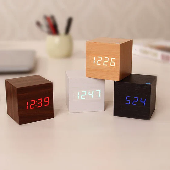 Modern sleek digital wood LED clock for desk or home office decor. Minimalist timepiece with clear display.