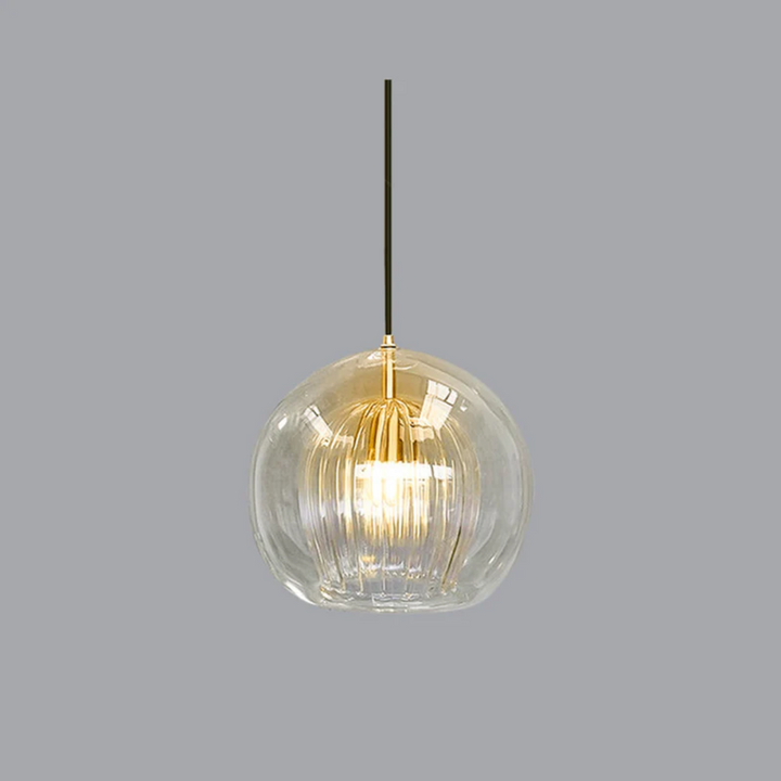 Modern sphere LED pendant light with a clear glass shade, emitting warm white ambient light for contemporary home decor.