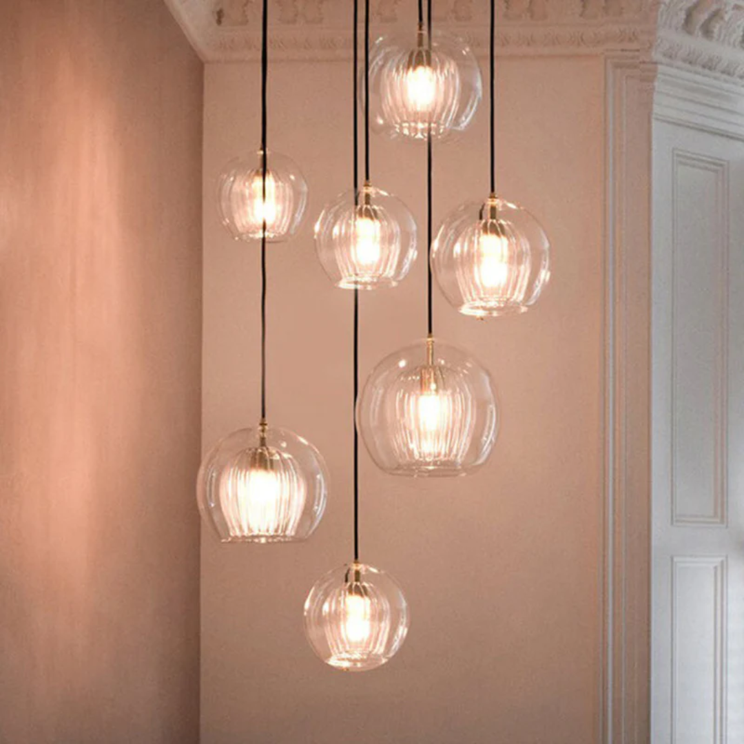 Adjustable modern spherical LED pendant light, Aurora Sphere, for stylish interiors.
