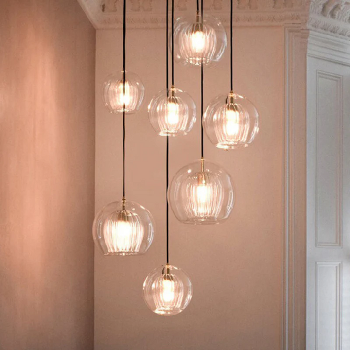 Adjustable modern spherical LED pendant light, Aurora Sphere, for stylish interiors.