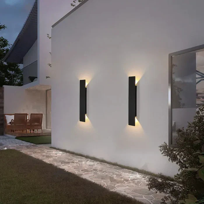 Sleek StormGlow up down exterior wall lamp with modern design, ideal for architectural outdoor lighting and patio ambiance.