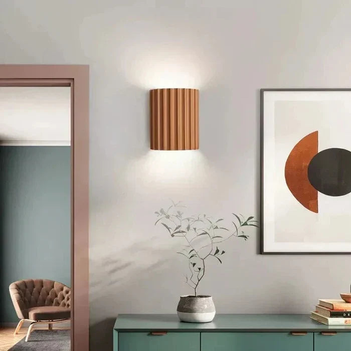 Decorative LED wall lamp providing ambient lighting for modern bedrooms.