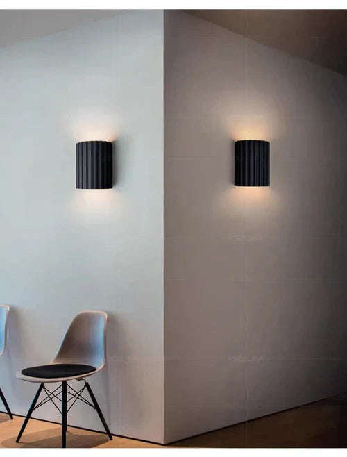 Sleek wave design wall lamp, a modern artistic lighting piece for interior design.