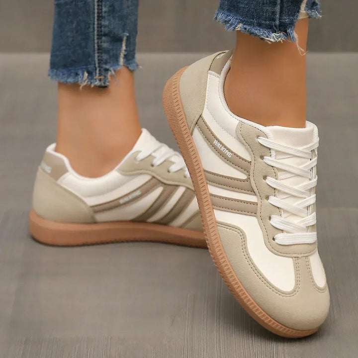 Stylish faux suede women's low-top lace-up sneakers, perfect for walking and sporty everyday wear.