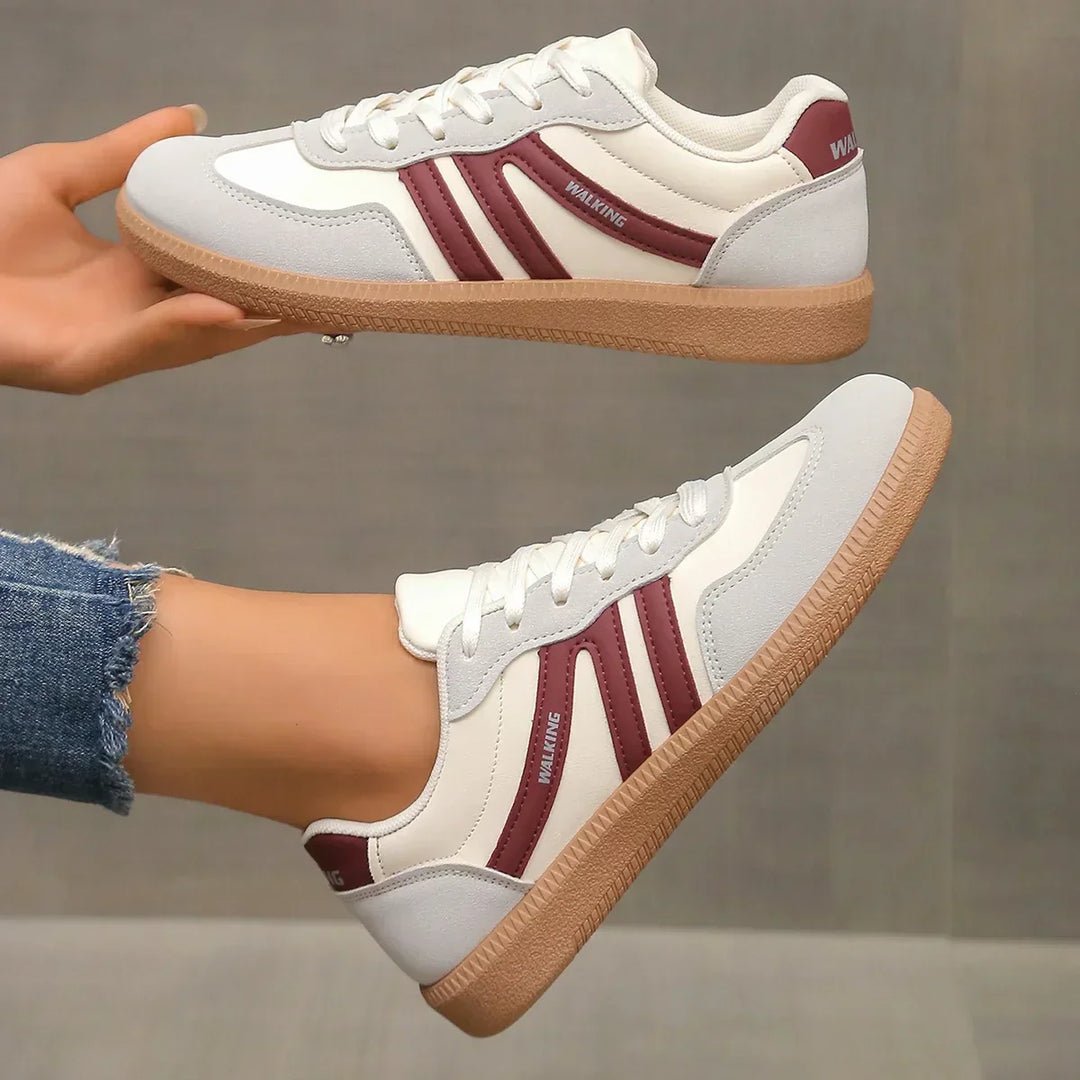 Fashionable women's low-top lace-up sneakers with a modern design, great for casual comfort.
