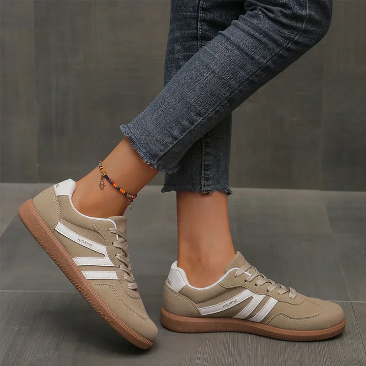 Comfortable women's low-top lace-up sneakers. Faux suede design for casual, sporty walking shoes.