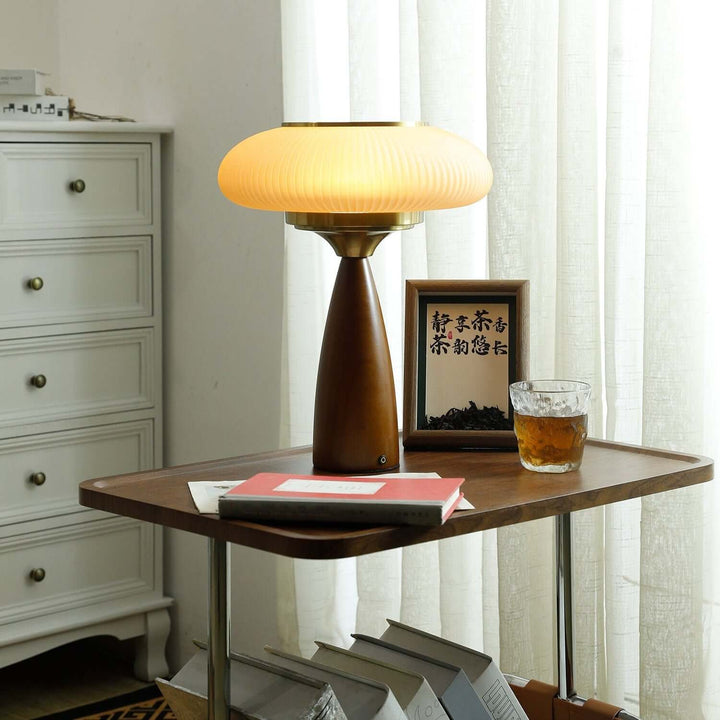Modern wooden table lamp with an elegant glass shade for stylish home decor.