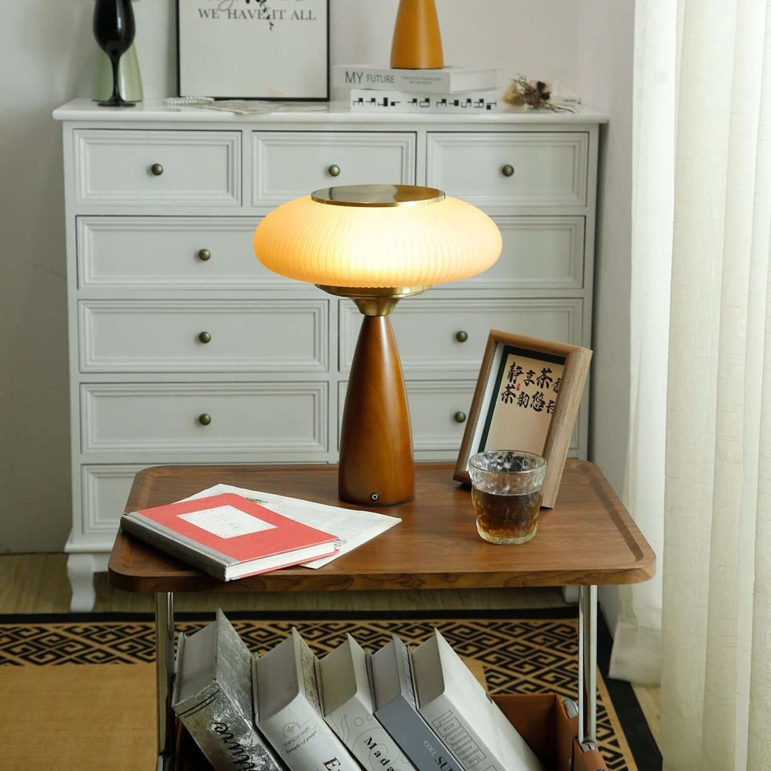 Unique wooden table lamp featuring a chic glass shade, a highlight of modern interior design.