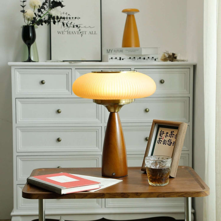 Modern lighting solution: wooden table lamp with a translucent glass shade for diffused light.