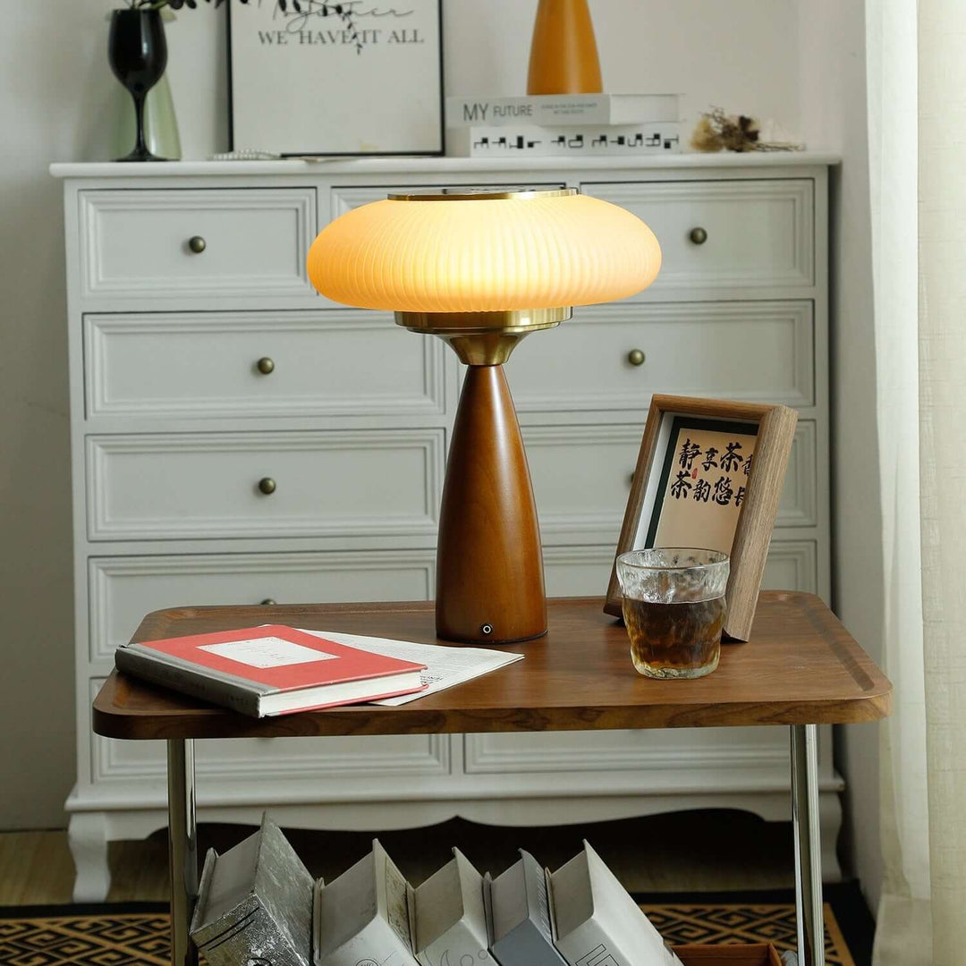 Sleek modern wooden table lamp with an exquisite glass shade, versatile for desk or bedside.