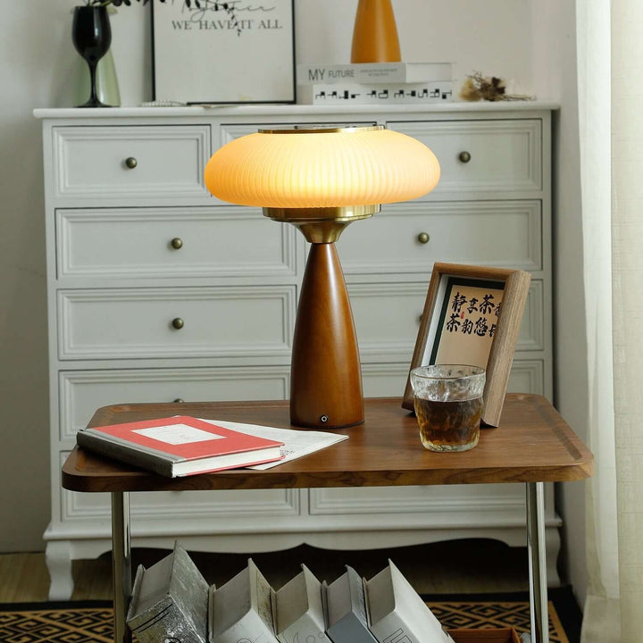 Sleek modern wooden table lamp with an exquisite glass shade, versatile for desk or bedside.