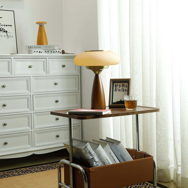 Stylish wooden lamp with a sleek glass shade, perfect as a bedside or desk lamp.