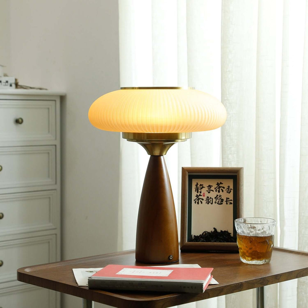 Elegant modern wooden table lamp with a beautiful glass shade, enhancing any interior design.