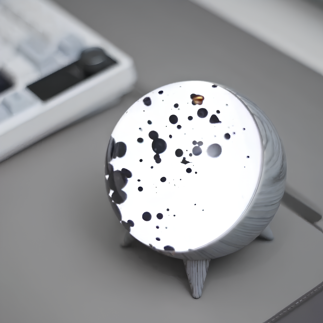 "Music-reactive ferrofluid display with black fluid art in motion, Bluetooth connectivity, and built-in lighting for tech lov