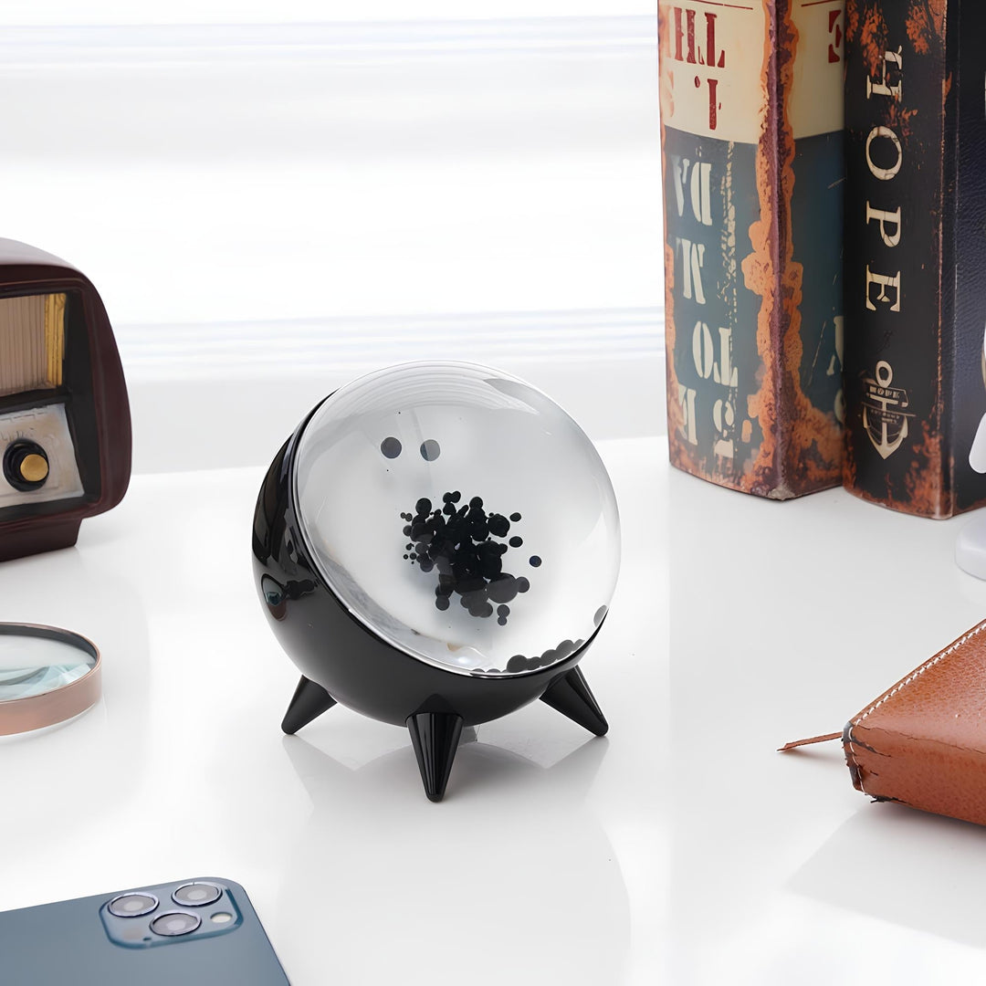 "Music-reactive ferrofluid display with black fluid art in motion, Bluetooth connectivity, and built-in lighting for tech lov
