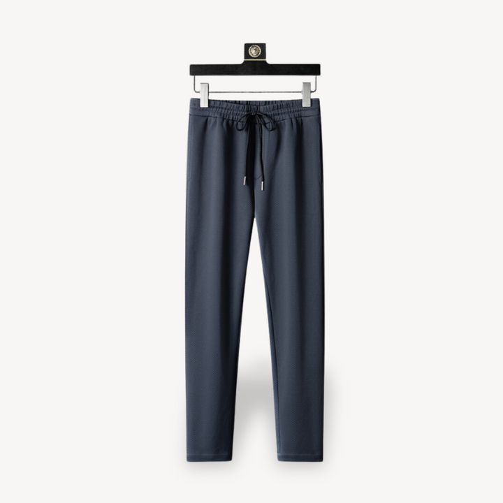 "Navy and black men's tracksuit set with zip jacket and joggers, showcasing sleek design and comfort for casual or gym wear."