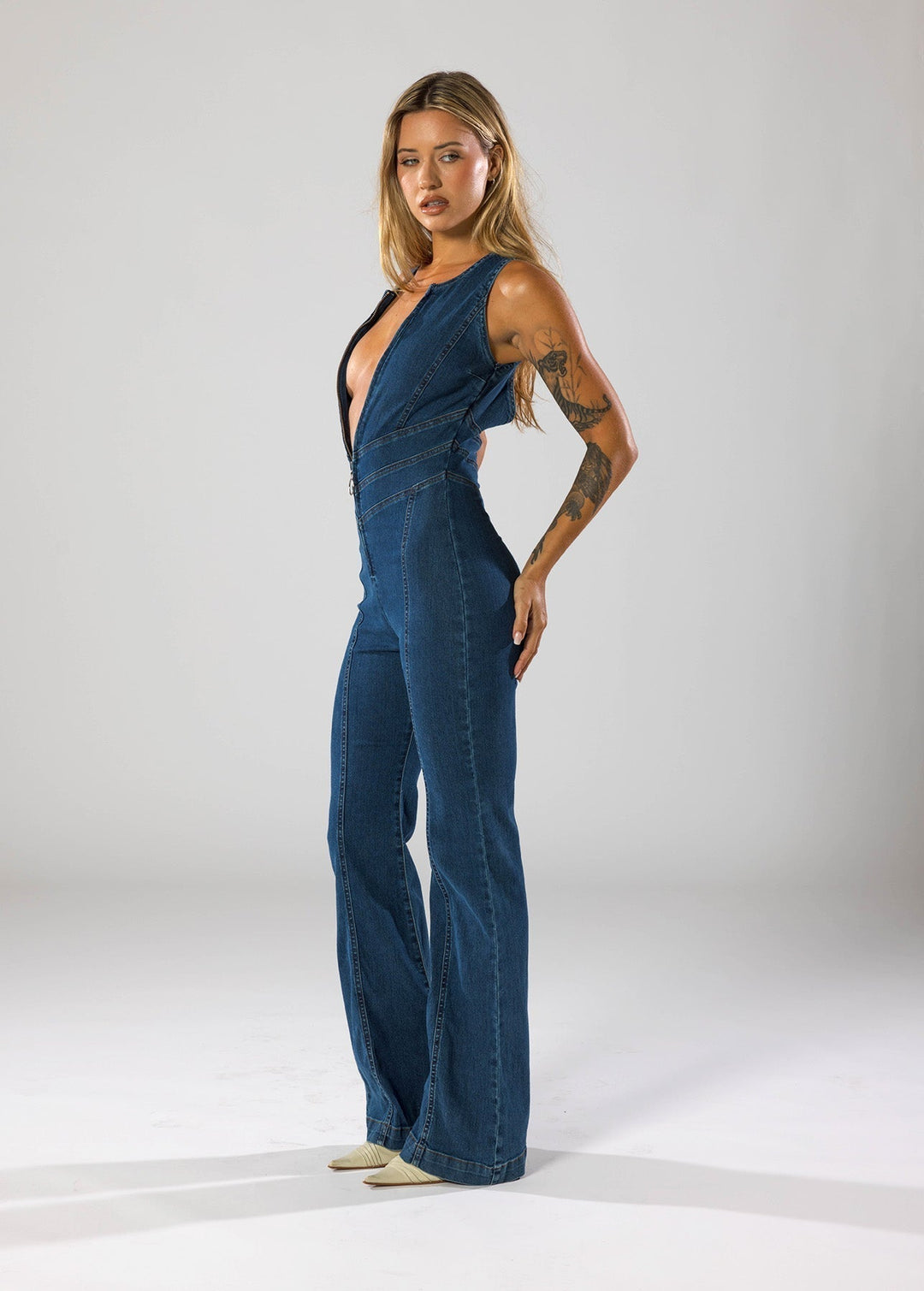 Chic navy blue women's heart plunge jumpsuit, a stunning fitted piece for evening & party fashion.