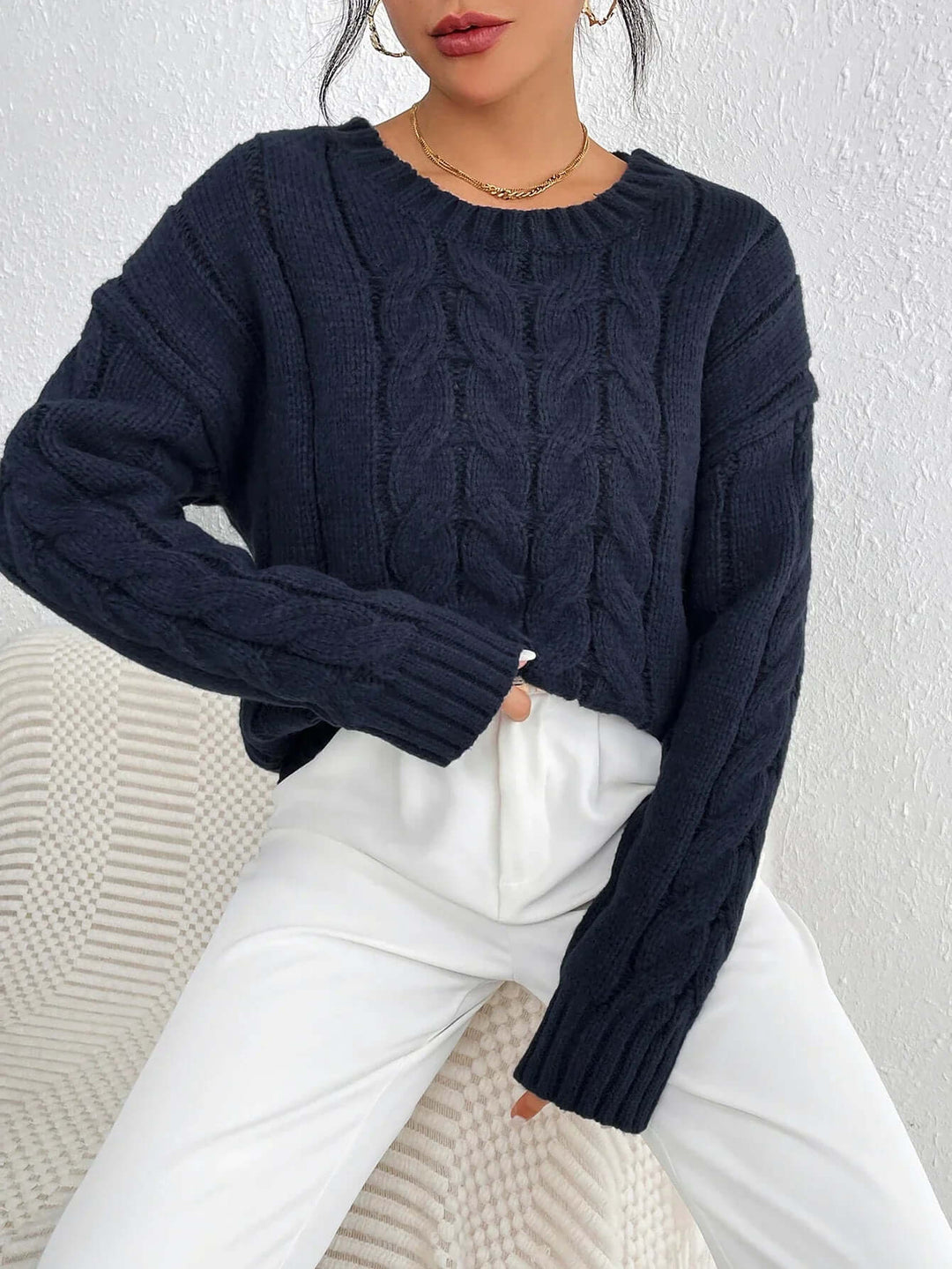 Navy blue women's twisted knit jumper. Cozy, loose fit sweater for winter fashion & casual style.
