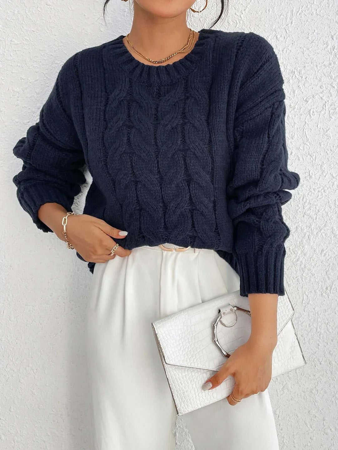 Cozy navy blue women's loose fit knitted jumper. Ideal winter fashion and casual wear for comfortable style.