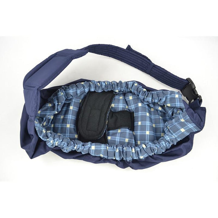 Parent bonding with newborn in a comfortable baby carrier sling wrap, fostering closeness & security.