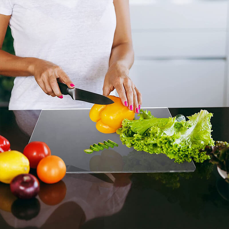 Sleek, clear acrylic non-slip chopping board for stylish & safe kitchen cutting. Easy to clean, very durable.