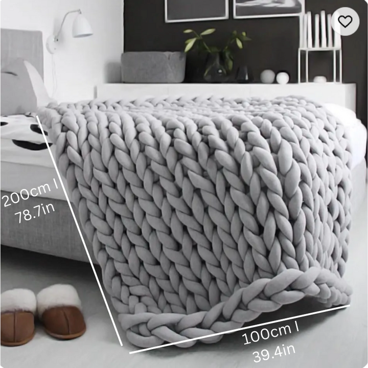 "Organic cotton weighted blanket in grey, offering cozy warmth and therapeutic pressure for all seasons. Available in multipl