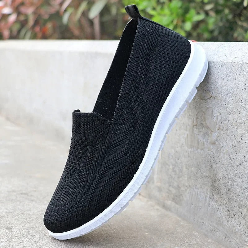 Orthopedic walking shoes for women, breathable slip-on design with arch support.