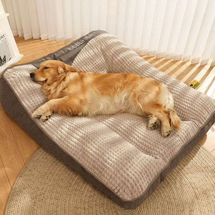 Gray orthopedic dog bed, a premium pet accessory. Provides neck & spine support with a durable, washable cover.