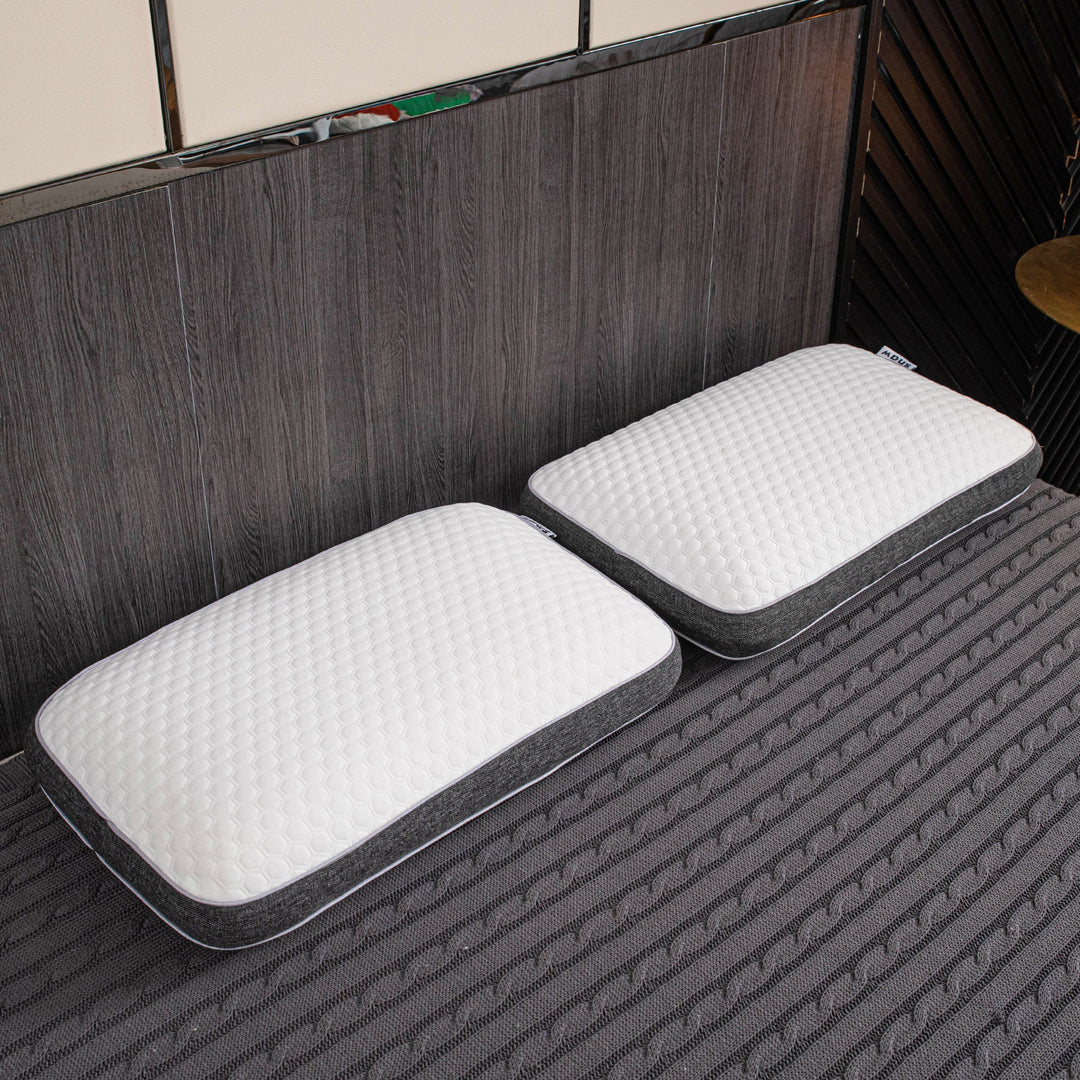 Orthopedic memory foam pillow offering pain-free sleep with ergonomic design and breathable cover for all sleep positions.
