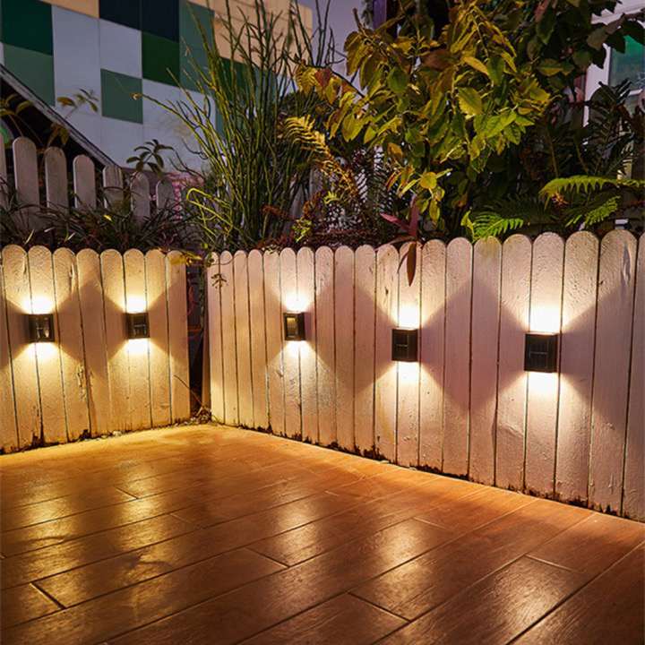 Outdoor LED solar wall lights with automatic sensor, eco-friendly design, providing warm glow for gardens, patios, driveways.
