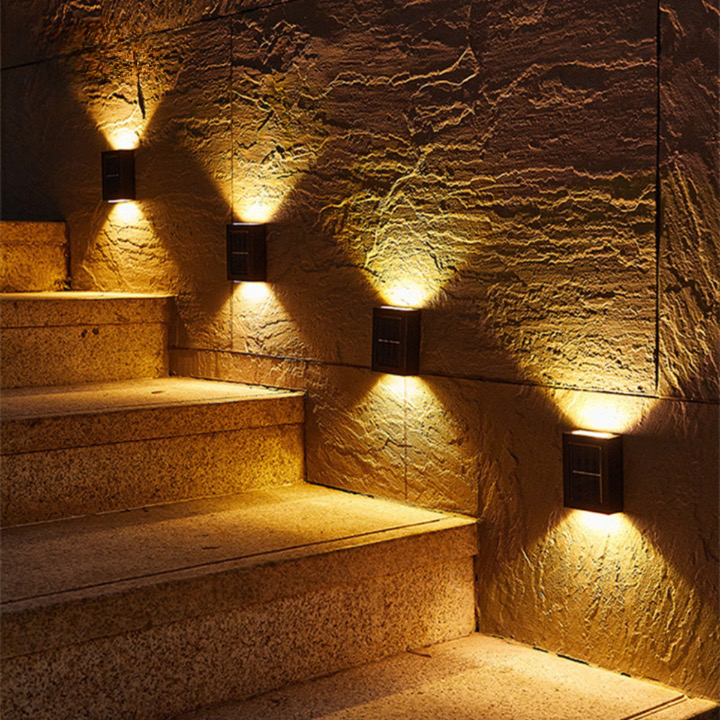 Outdoor LED solar wall lights with automatic sensor, eco-friendly design, providing warm glow for gardens, patios, driveways.