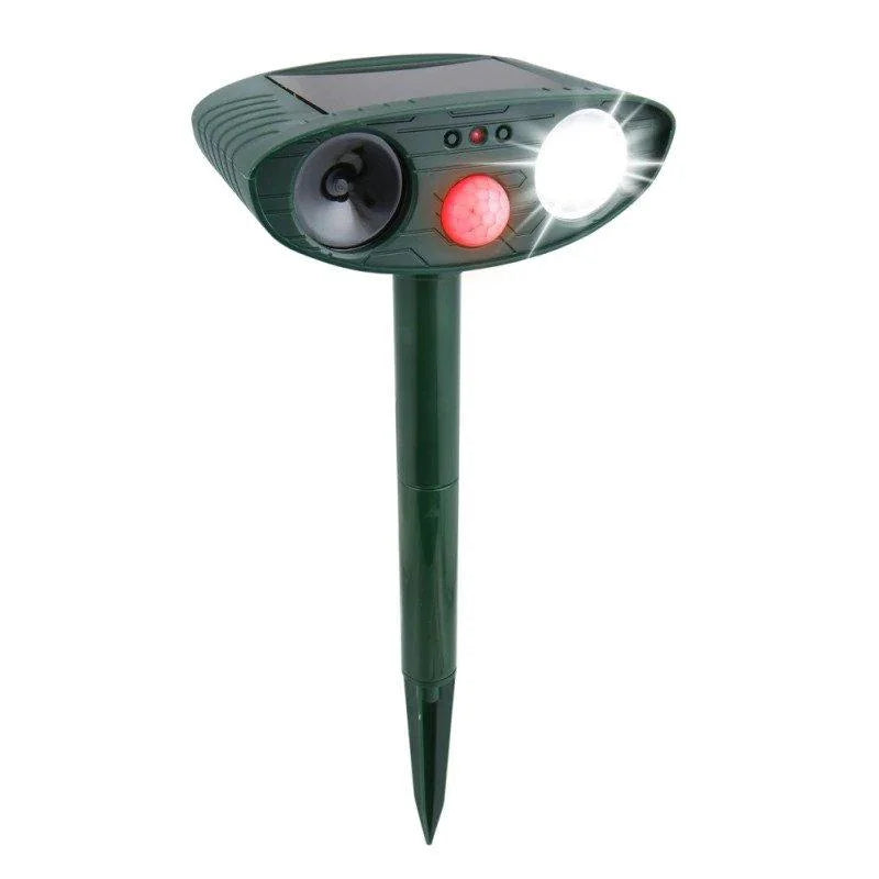 "Outdoor solar-powered ultrasonic deer repeller in garden setting, showcasing green and grey weather-resistant design."