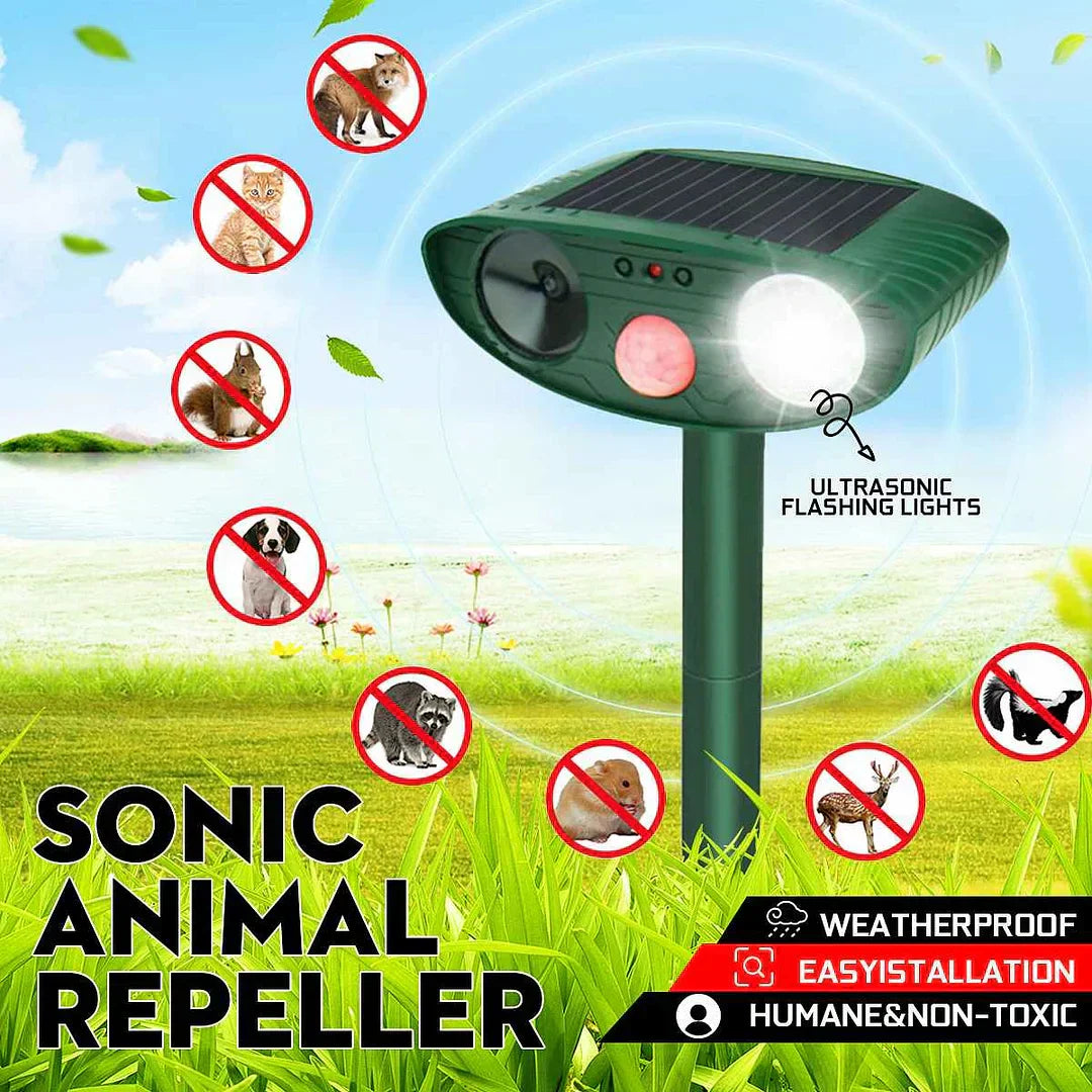 "Outdoor solar-powered ultrasonic deer repeller in garden setting, showcasing green and grey weather-resistant design."