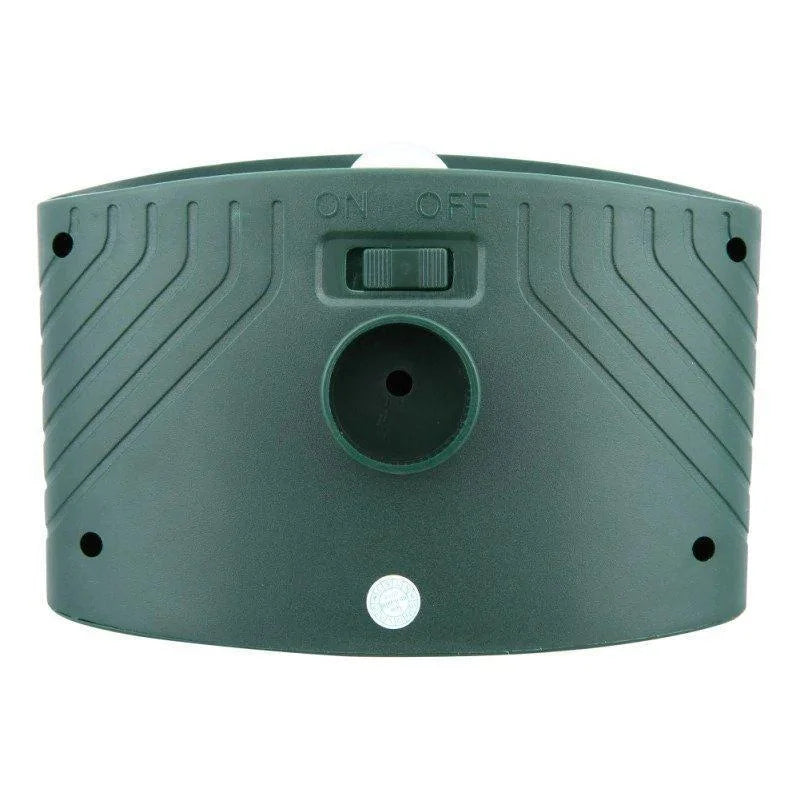 "Outdoor solar-powered ultrasonic deer repeller in garden setting, showcasing green and grey weather-resistant design."