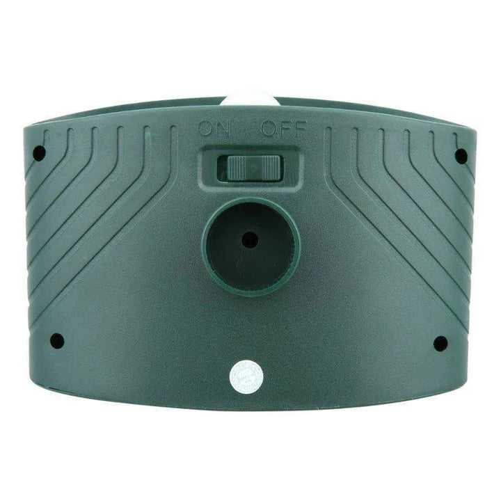 "Outdoor solar-powered ultrasonic deer repeller in garden setting, showcasing green and grey weather-resistant design."