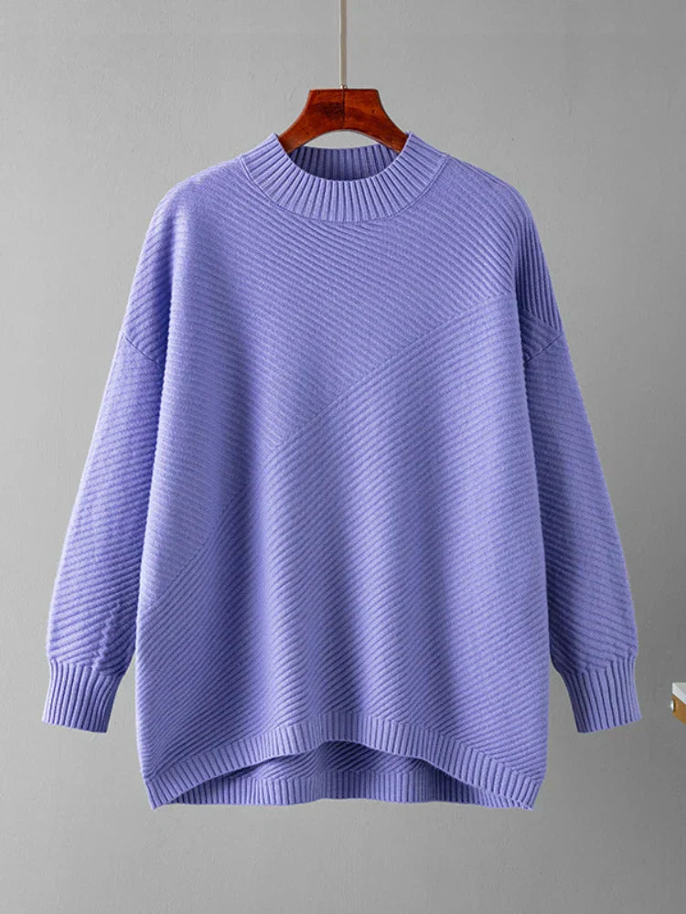 Soft ribbed knit oversized women's jumper in pink, a cozy and stylish crew neck pullover.