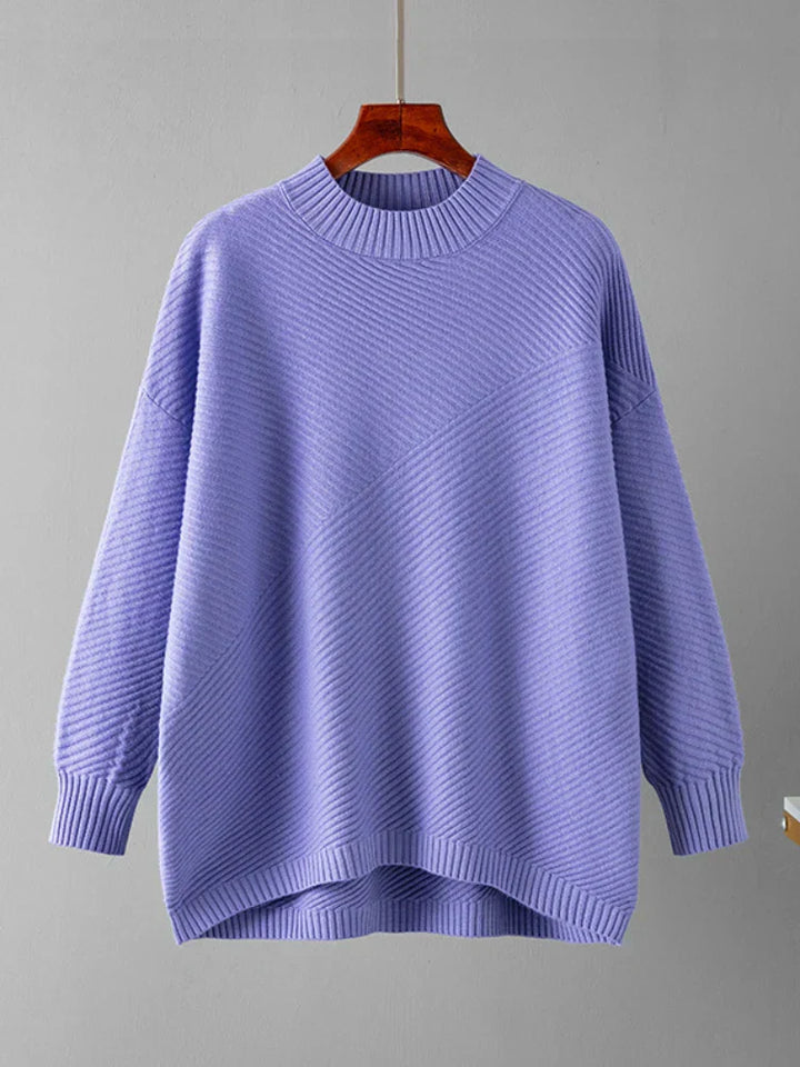 Soft ribbed knit oversized women's jumper in pink, a cozy and stylish crew neck pullover.