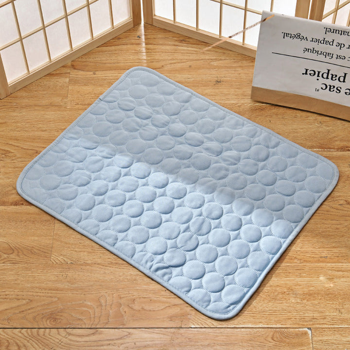 "Pet cooling pad in light blue, ideal for summer. Features breathable, machine-washable fabric, available in multiple sizes."