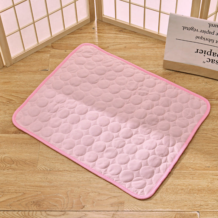 "Pet cooling pad in light blue, ideal for summer. Features breathable, machine-washable fabric, available in multiple sizes."