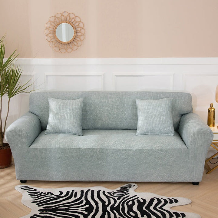 "Pistachio solid colour sofa cover, vibrant protective slipcover fits various sofa sizes, adds edgy style to living room."
