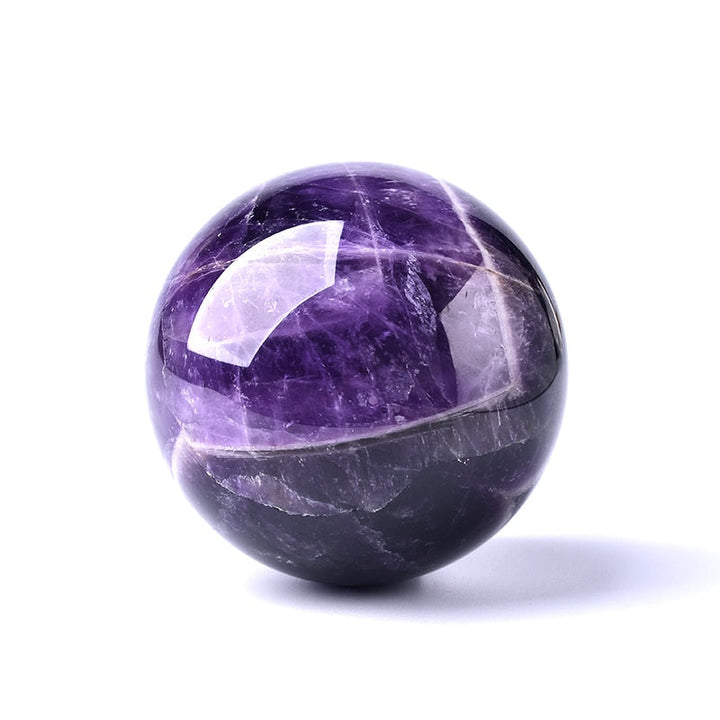 Beautiful purple Amethyst sphere, a decorative crystal accent & healing stone for tranquil meditation spaces.