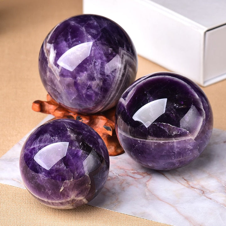 Natural Amethyst crystal sphere, ideal for spiritual decor, providing calming energy & a beautiful accent.